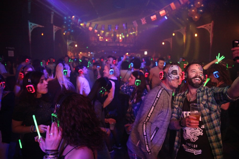 Partiers with headphones at The Silent Disco Show